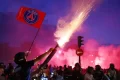 Paris police arrest more than 130 as PSG fans celebrate Champions League win over Arsenal