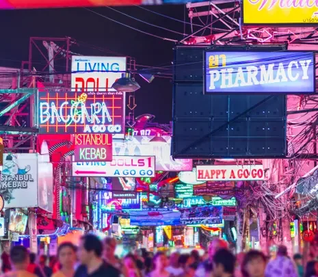 In Thailand’s sex tourism hub, bright lights flash, loud music blares – and underage girls are exploited