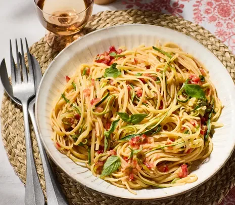 Rachel Roddy’s recipe for pasta with courgette, onion and raw tomato salsa
